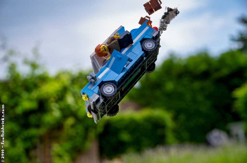 LEGO vehicle flying ogg a cliff