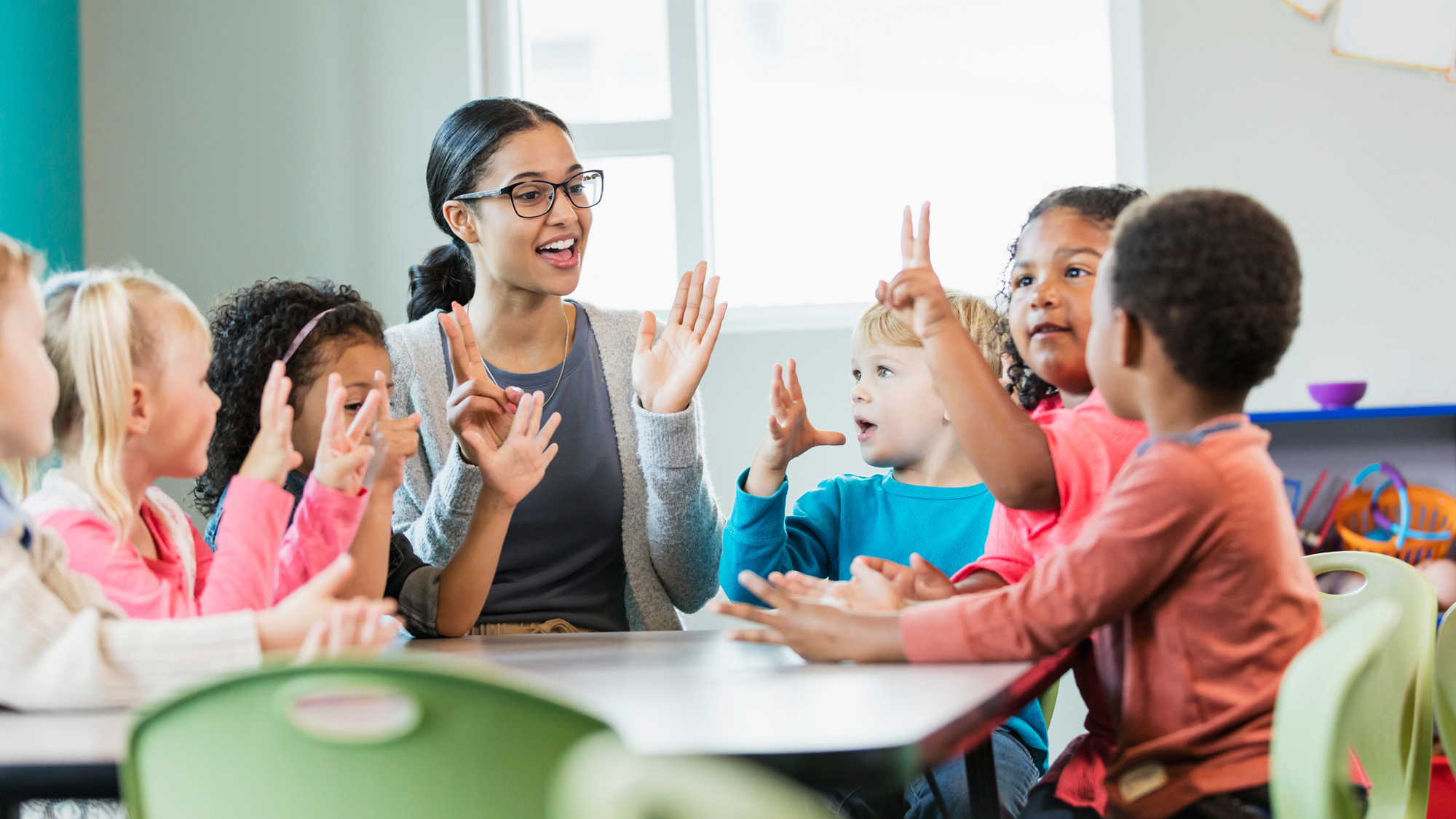 Teacher with young students learning to count