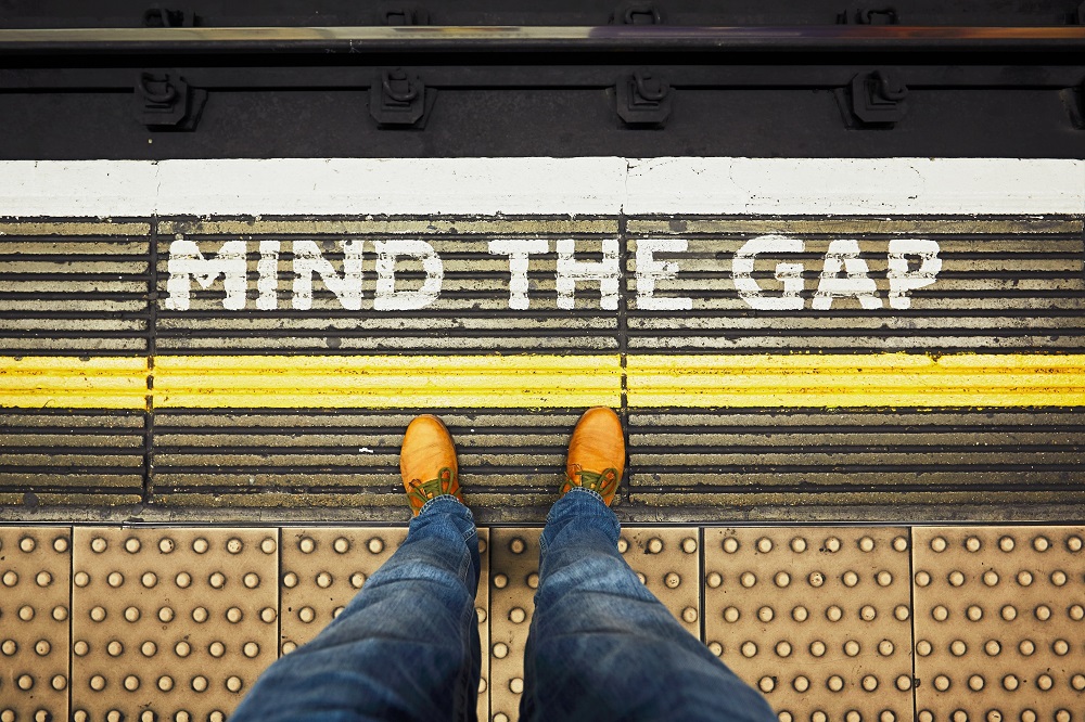 "Mind The Gap" Written on the edge of a subway platform