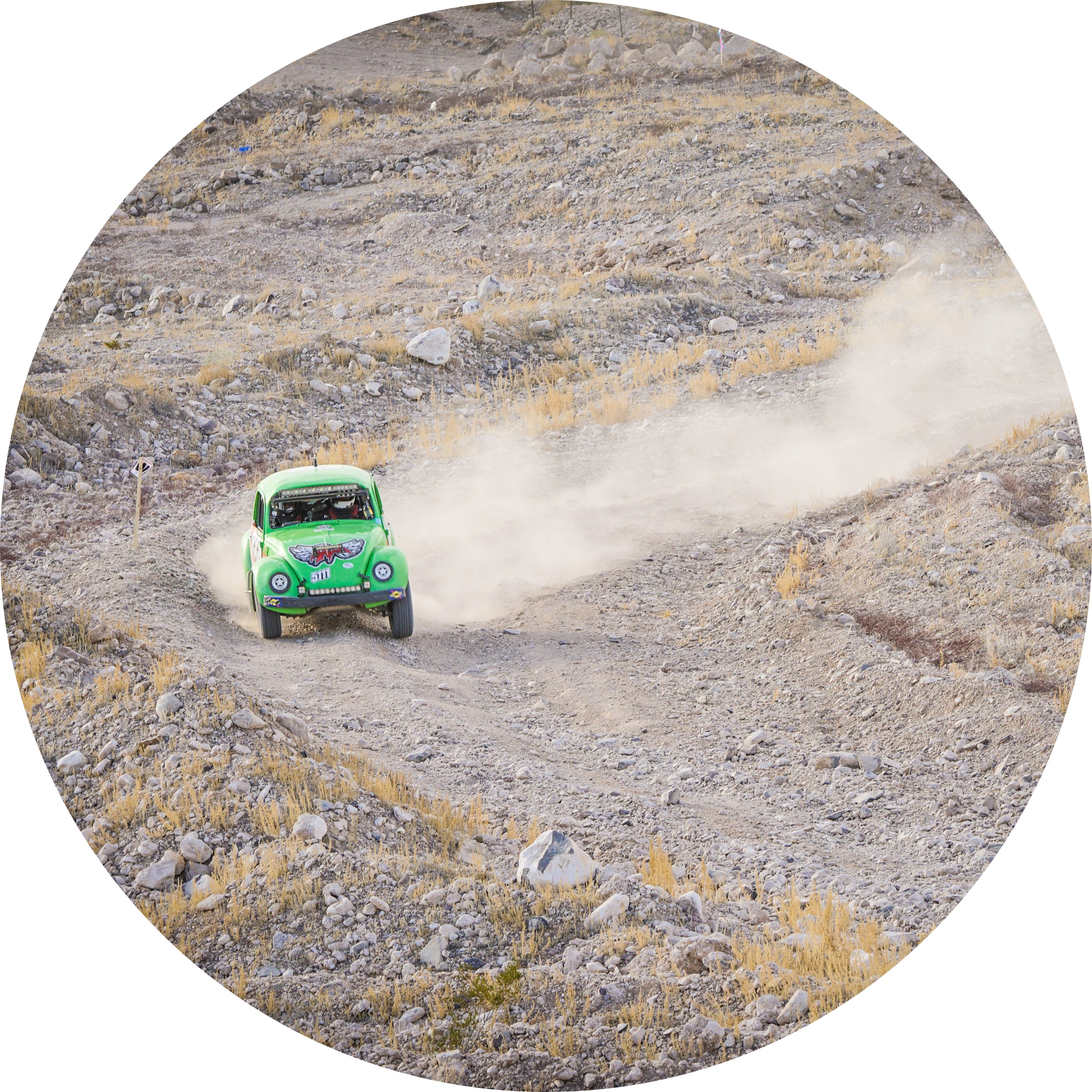 VW Beetle racing on a dirt track