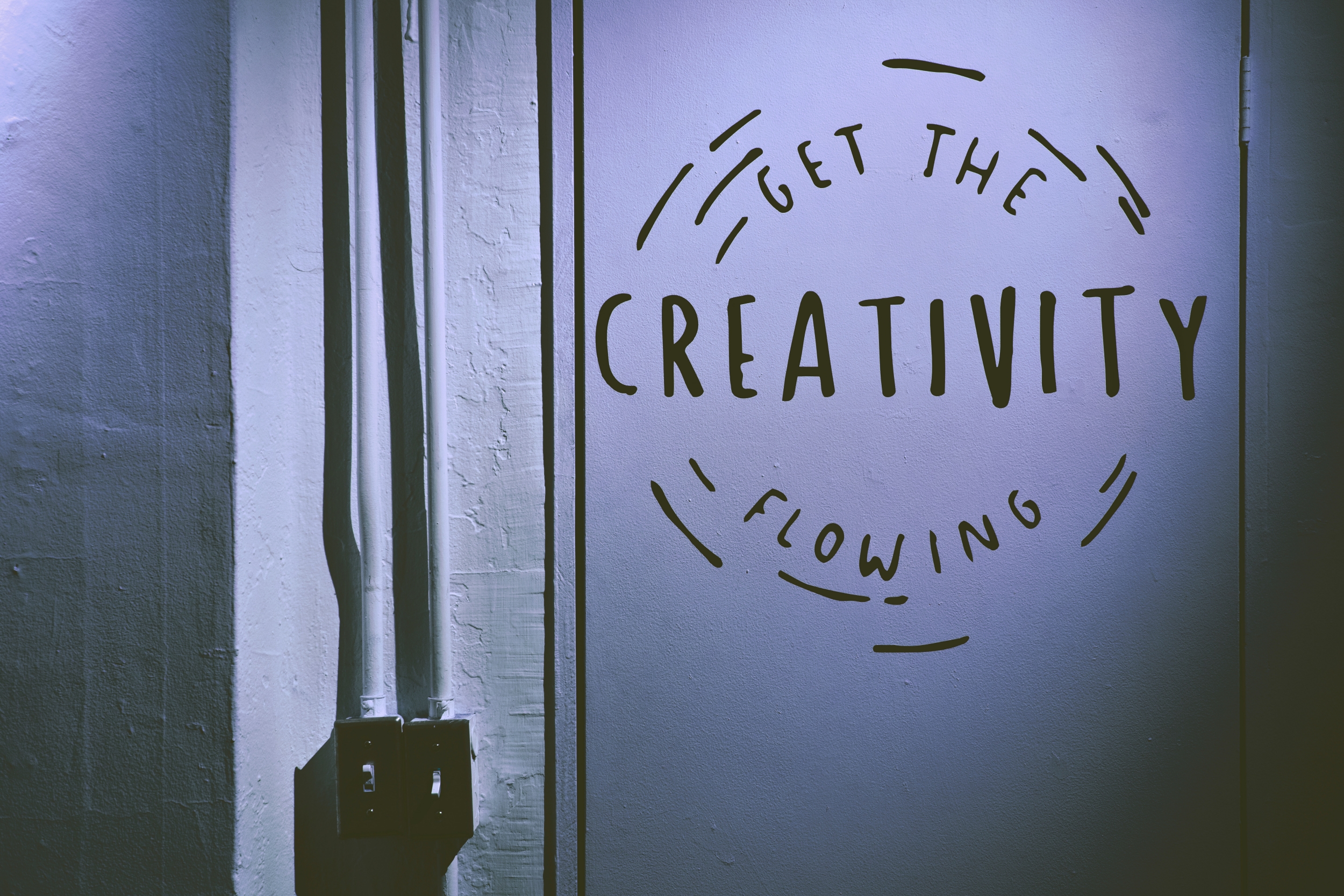 "Get the Creativity Flowing" written on a wall