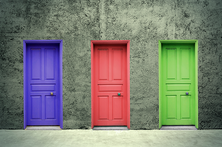 3 closed doors - one purple, one pink, and one green