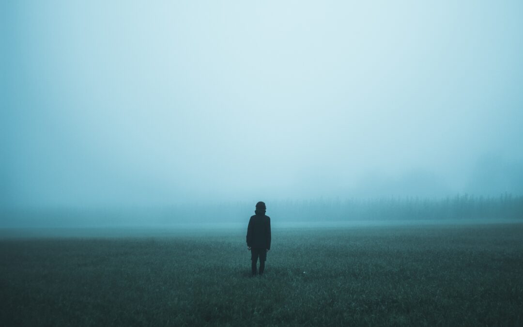 Person standing in the fog