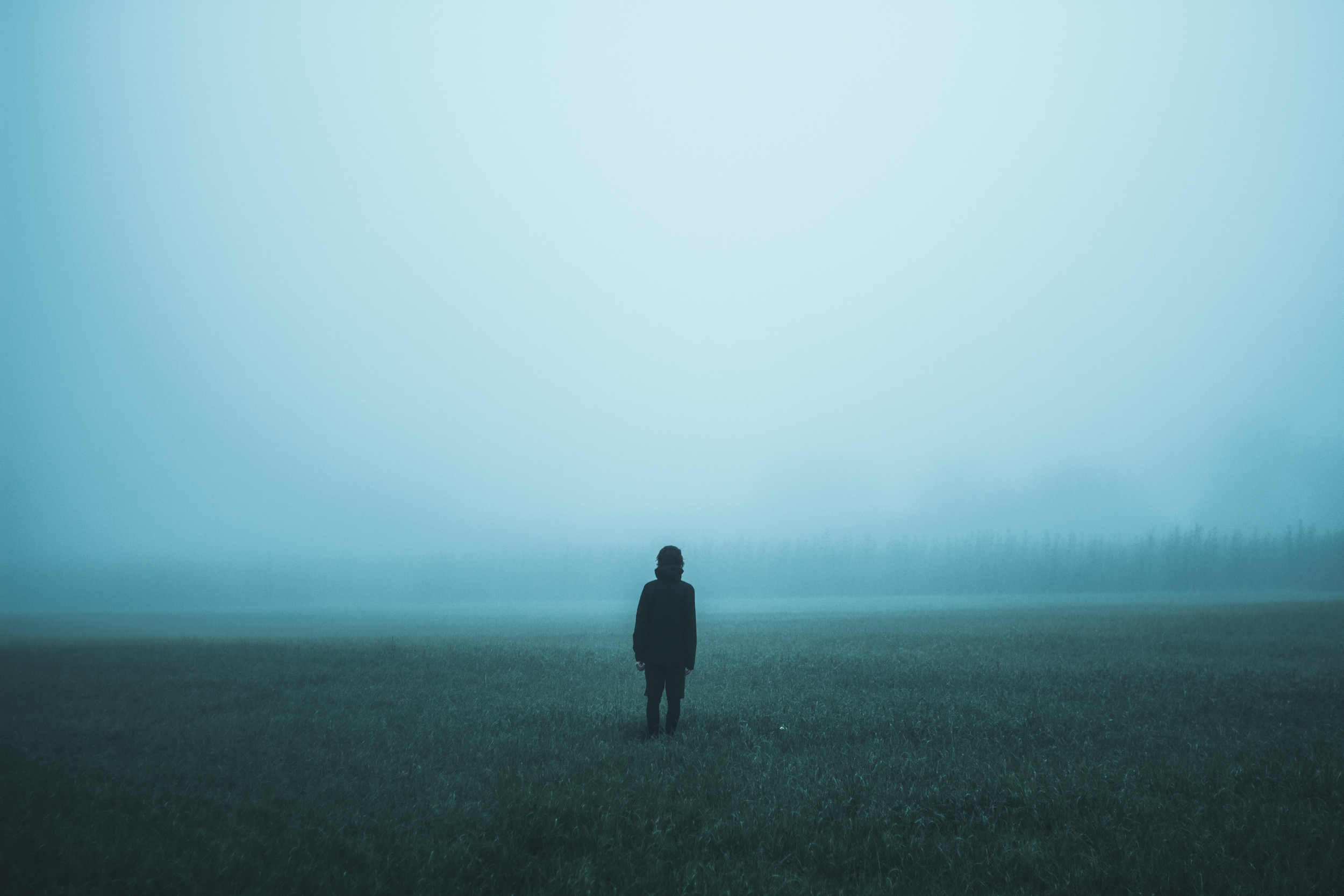 Person standing in the fog