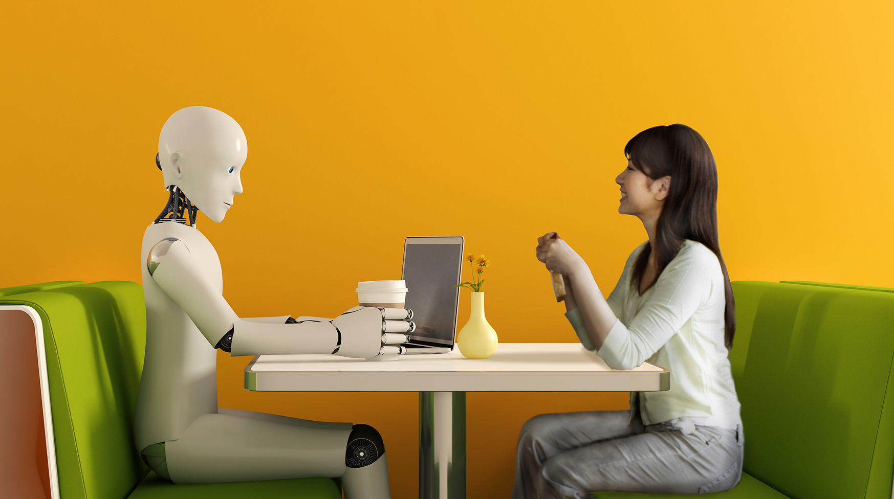 A robot and a human sitting in a booth having coffee together
