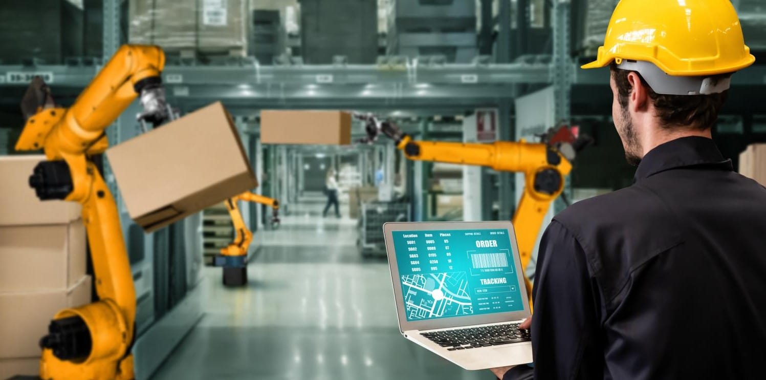 Robots and human working on the factory floor
