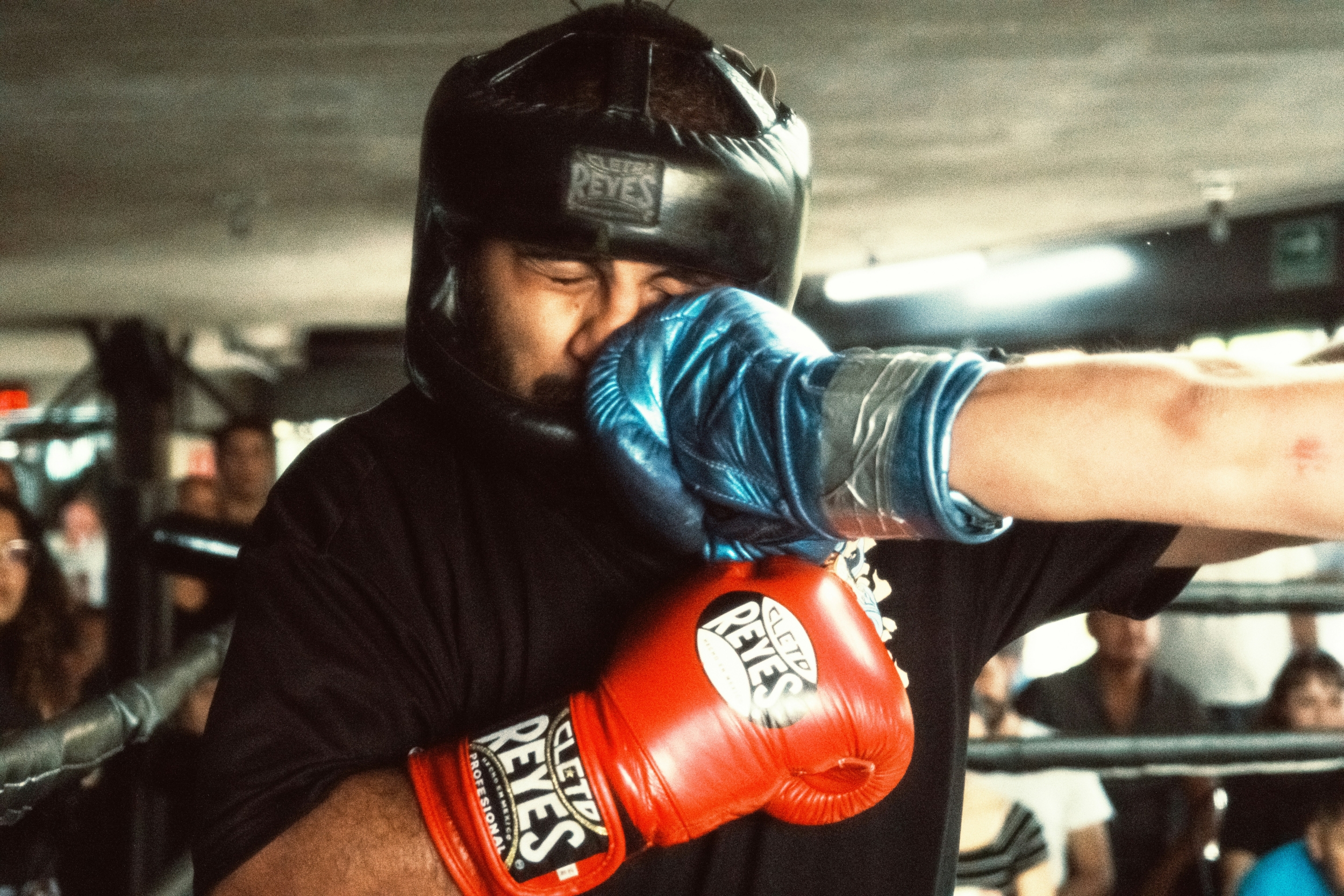 Man getting punched in the face during a boxing match