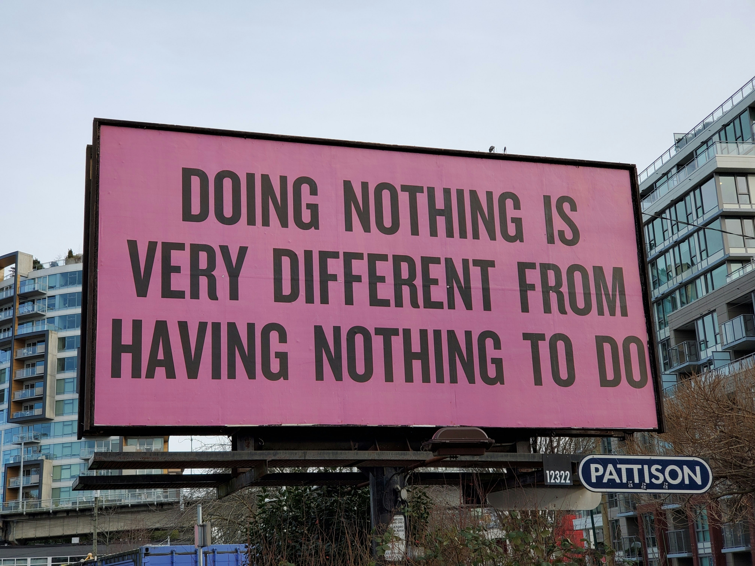 Billboard that reads "Ding Nothing is Very Different From Having Nothing To Do"