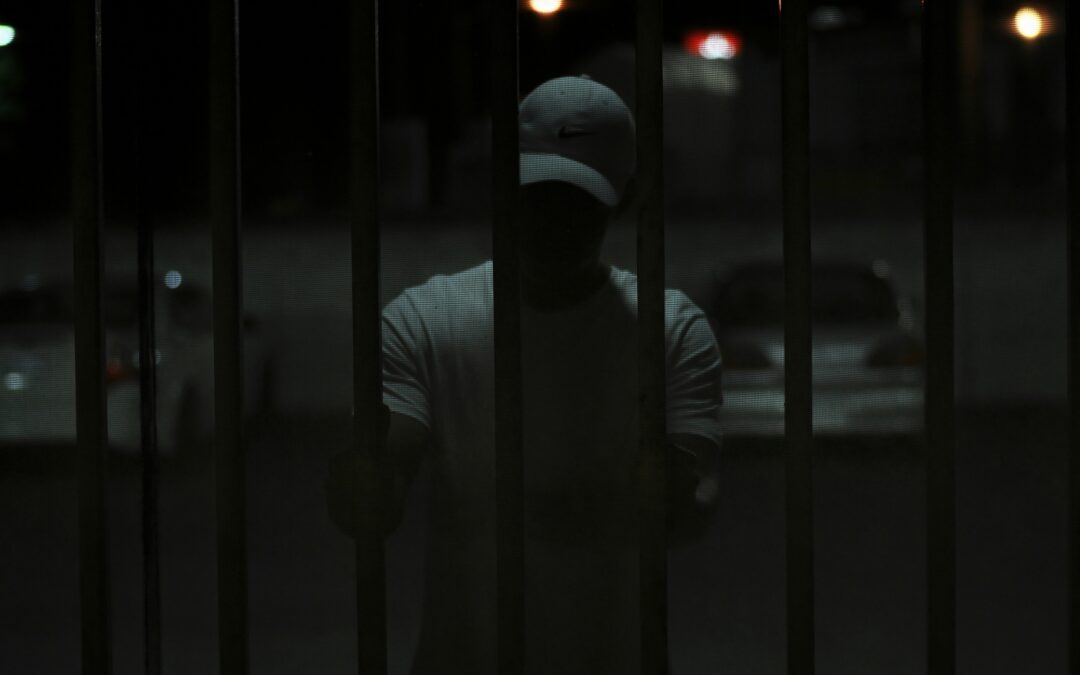 Shadowy figure looking out at the viewer