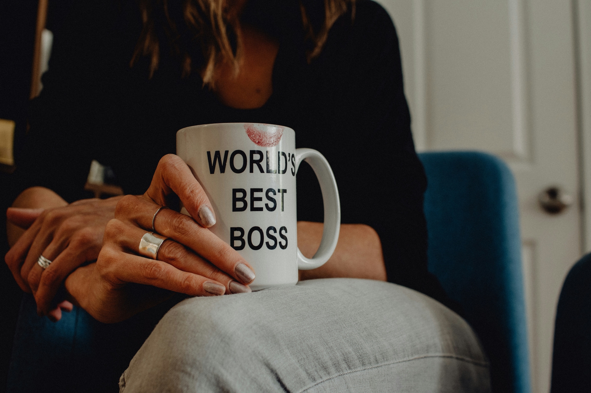 Woman holding "World's Best Boss" mug