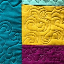 four quilted pieces joined together